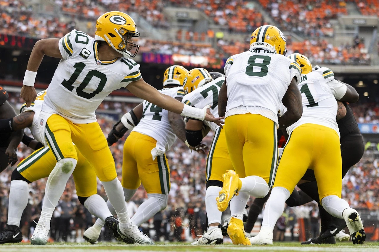Ultimate Josh Jacobs Injury Update: Top 5 Knee Scare Moments in Packers Game 1 Josh Jacobs, Packers RB, running with a football during a game, hinting at a knee injury