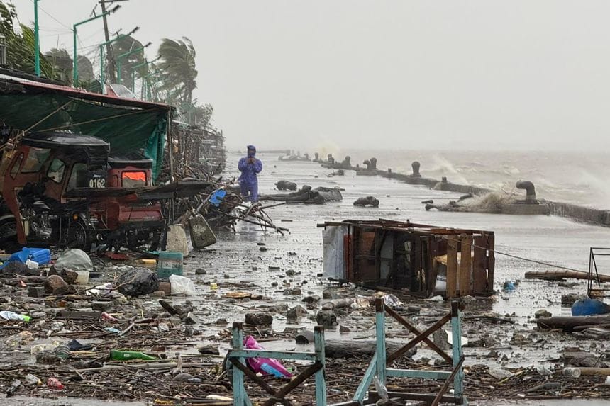 Devastating Super Typhoon Ragasa Devastates Asia in 2025 3 Coastal devastation after Super Typhoon Ragasa: wrecked vehicles, scattered debris, and a rescuer amid floodwaters and storm surges in 2025.